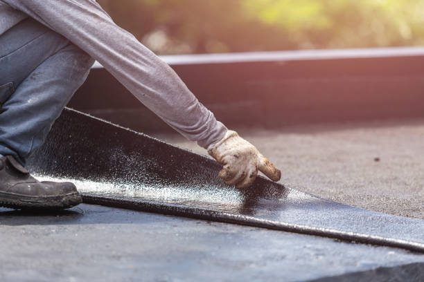 Professional Basement Waterproofing technician working in Burton, OH